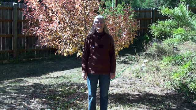 Debra Standing in Front of Pear Tree - Grounding Chakra Exercise