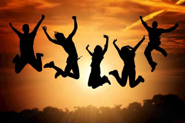 People Jumping in Success- Transforming limitation into success