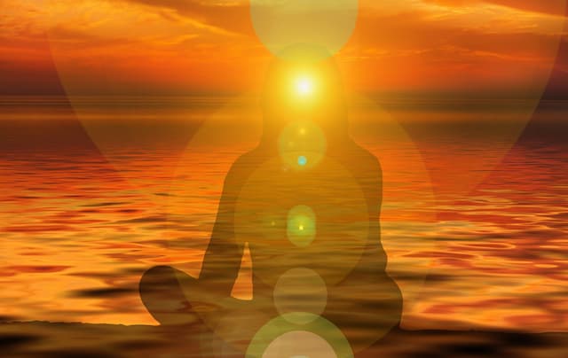 Sunset over head of woman with Powerful Spiritual Energies