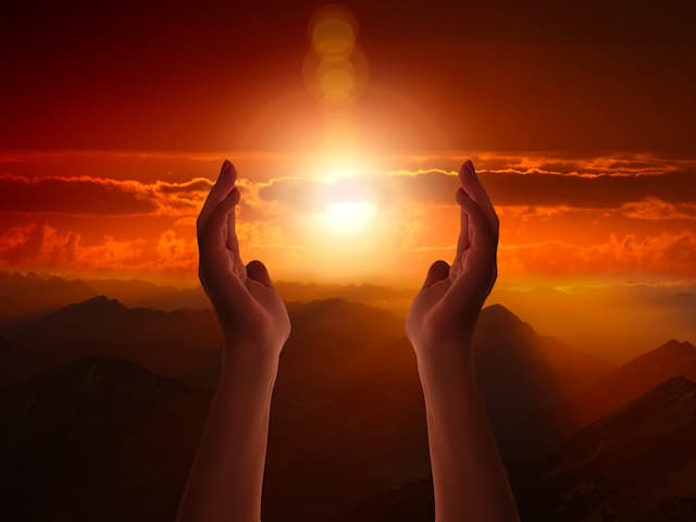 Serendipitous Surrender - hands raised toward the sun