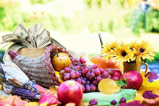 Corucopia with fruits, vegetables and money -Living in Abundance